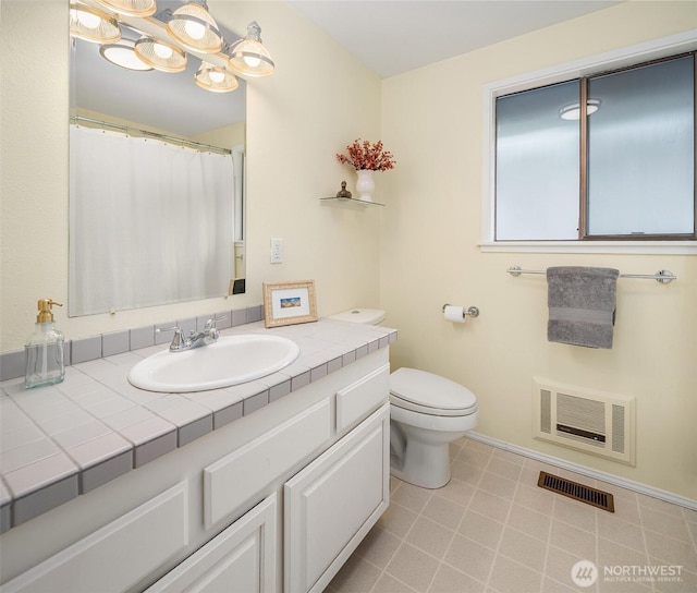 full bath with vanity, tile patterned floors, toilet, and visible vents