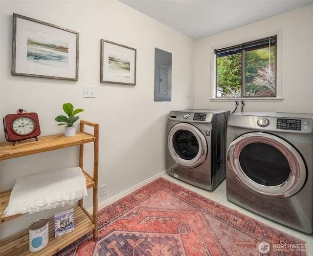 laundry room with laundry area, electric panel, separate washer and dryer, and baseboards