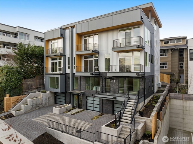 exterior space with stairs and a patio