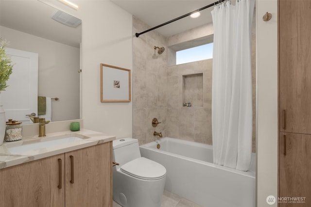 bathroom featuring toilet, visible vents, vanity, and shower / tub combo with curtain