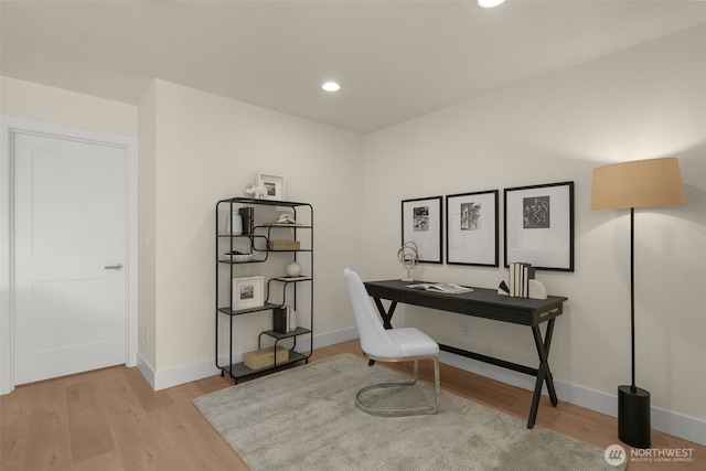 office area featuring recessed lighting, baseboards, and light wood finished floors