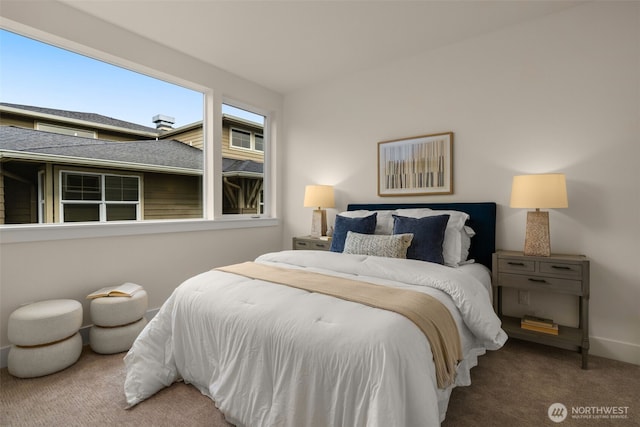 bedroom featuring carpet flooring and baseboards