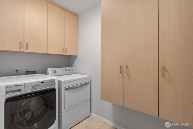 laundry room featuring cabinet space and independent washer and dryer