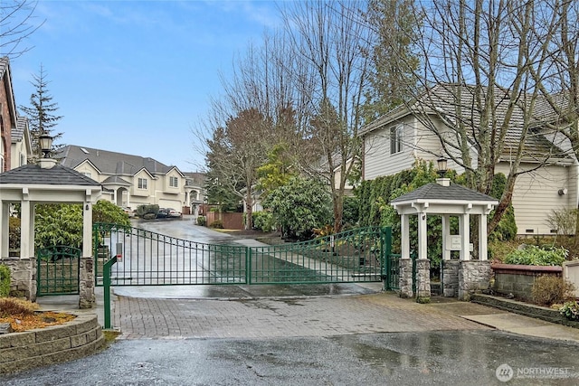 view of gate with a residential view