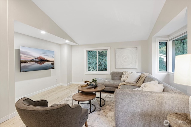 living room featuring light wood finished floors, baseboards, vaulted ceiling, and recessed lighting