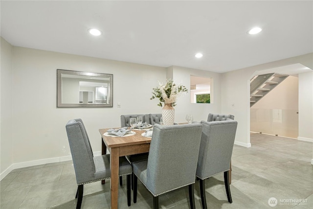 dining room featuring recessed lighting, baseboards, and stairs