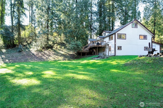 view of yard with stairway and a wooden deck