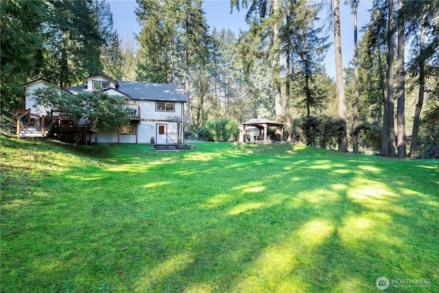 view of yard with a gazebo and a wooden deck