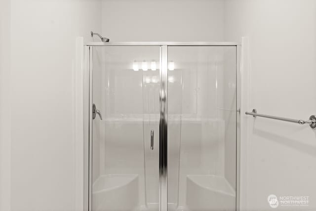 bathroom with a stall shower