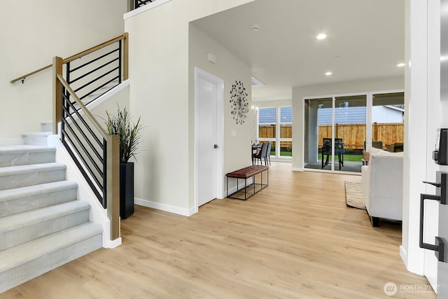 interior space featuring baseboards, wood finished floors, and recessed lighting