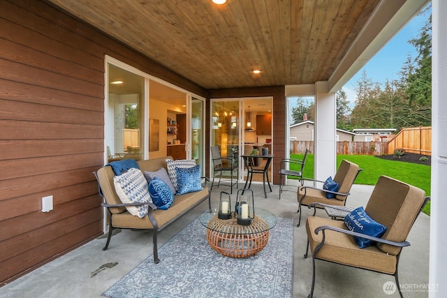 view of patio / terrace featuring an outdoor hangout area and fence