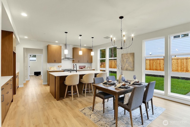 dining room featuring recessed lighting, visible vents, baseboards, light wood finished floors, and an inviting chandelier