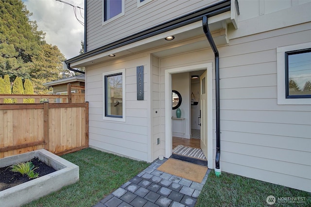 doorway to property with fence