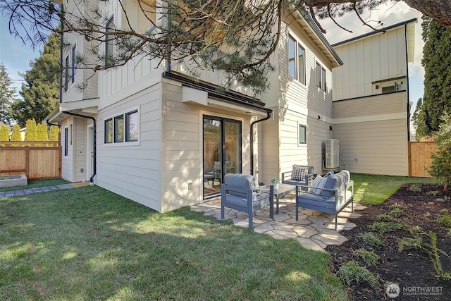 back of house featuring a yard, fence, and a patio