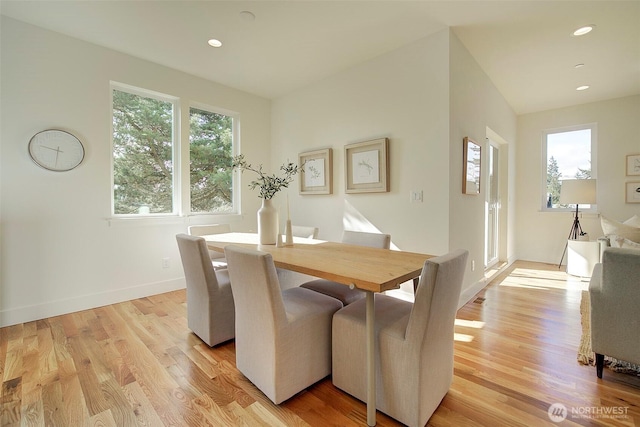 dining space with light wood-style floors, recessed lighting, and baseboards