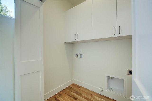 washroom with washer hookup, cabinet space, light wood-style flooring, electric dryer hookup, and baseboards