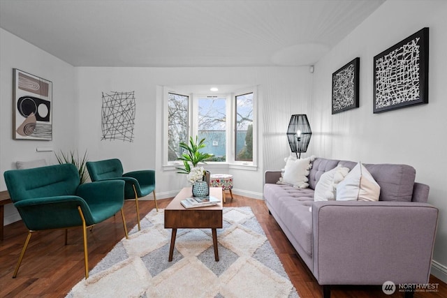 living room featuring baseboards and wood finished floors