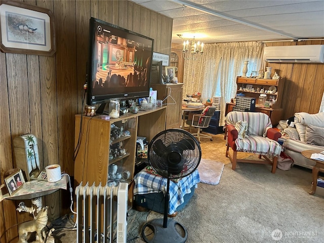 living area with radiator, an inviting chandelier, carpet flooring, wooden walls, and a wall mounted air conditioner