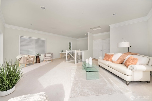 living area with recessed lighting, carpet floors, attic access, and ornamental molding