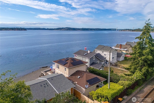 birds eye view of property with a water view and a residential view