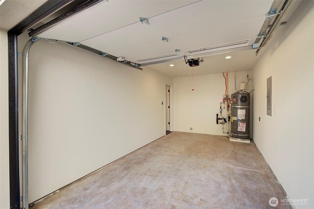 garage featuring secured water heater, electric panel, and a garage door opener