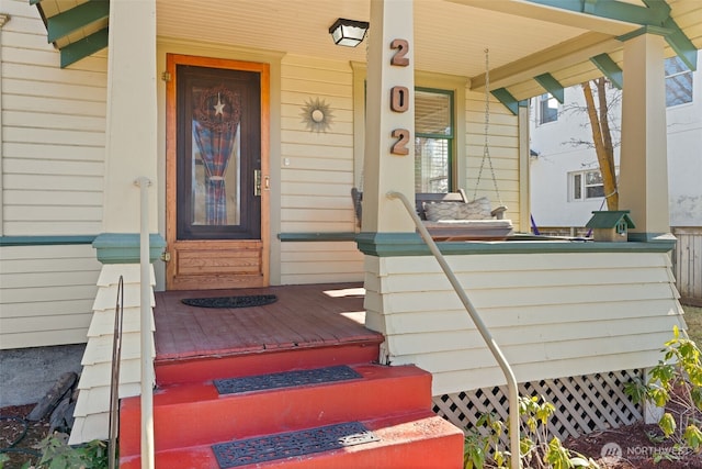 doorway to property with covered porch