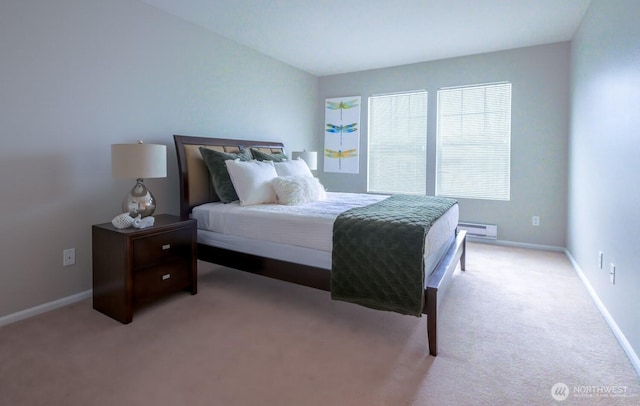 bedroom featuring baseboards, a baseboard heating unit, vaulted ceiling, and light colored carpet