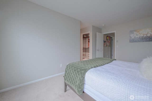 carpeted bedroom featuring baseboards