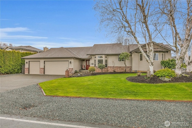 ranch-style home featuring aphalt driveway, a front yard, brick siding, and an attached garage