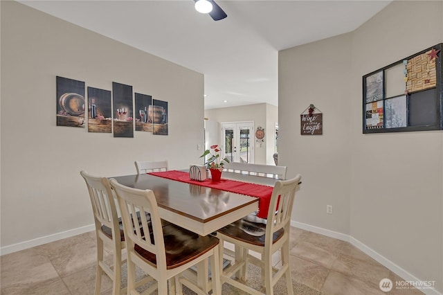 dining area featuring french doors and baseboards