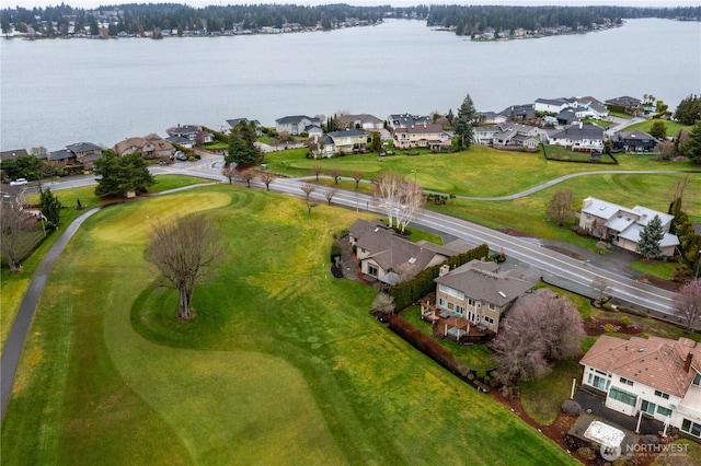 drone / aerial view featuring a water view and a residential view