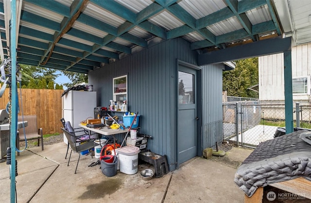 view of patio featuring fence