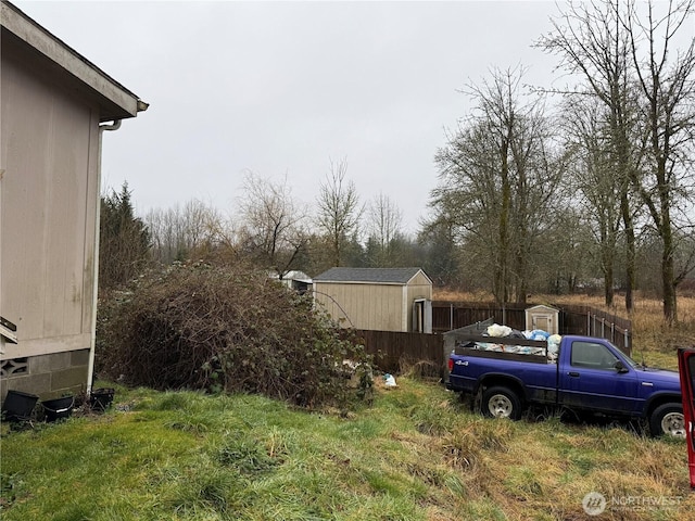 view of yard with an outdoor structure and a storage unit