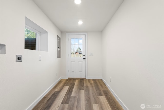 entryway featuring a healthy amount of sunlight, baseboards, wood finished floors, and recessed lighting