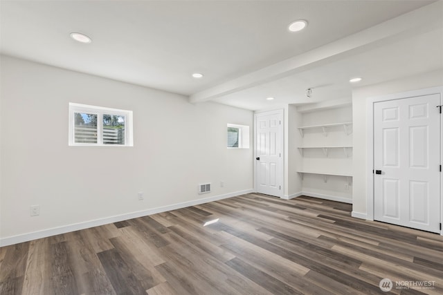 unfurnished bedroom featuring baseboards, visible vents, wood finished floors, and recessed lighting