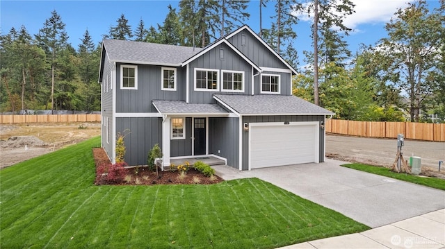 view of front of property with roof with shingles, fence, driveway, and a front lawn