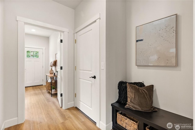 hallway with light wood-type flooring