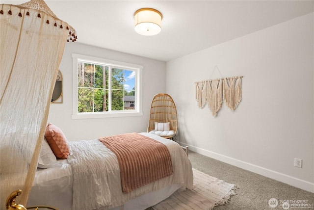 carpeted bedroom with baseboards