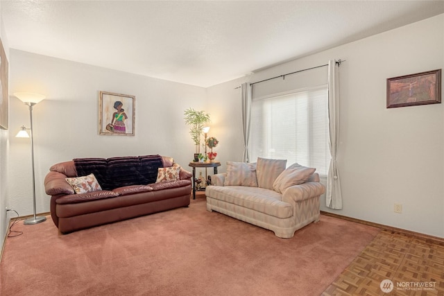 living area with light carpet and baseboards