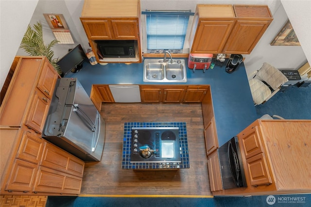 kitchen featuring a sink and black appliances