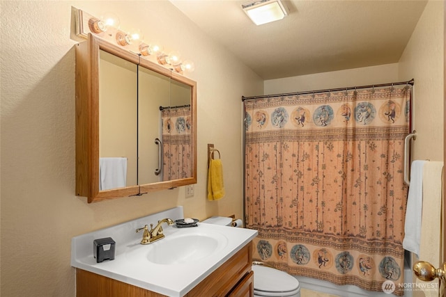 full bathroom with vanity and toilet