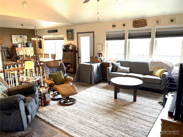 living area with plenty of natural light, ceiling fan, and wood finished floors