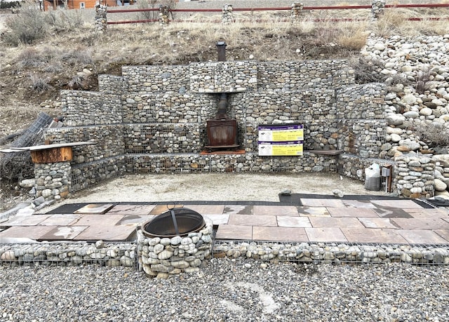 view of patio / terrace with an outdoor fire pit