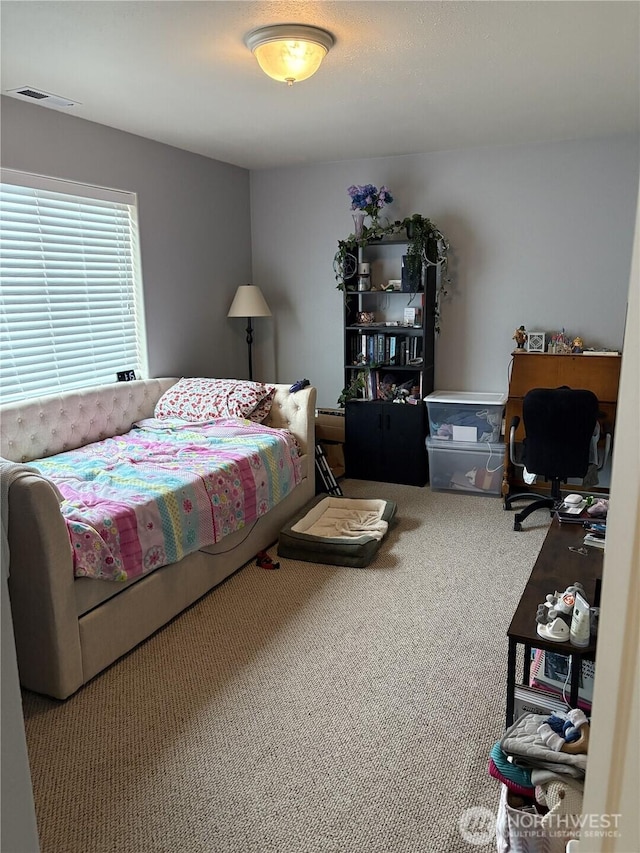 carpeted bedroom with visible vents