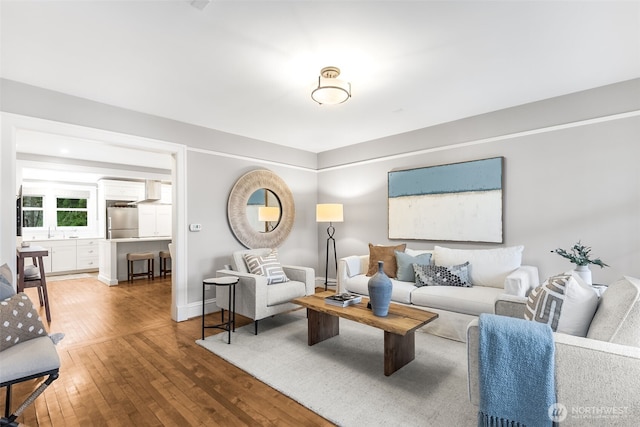 living room featuring baseboards and wood finished floors