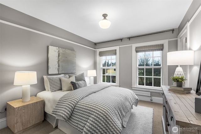 bedroom featuring light carpet