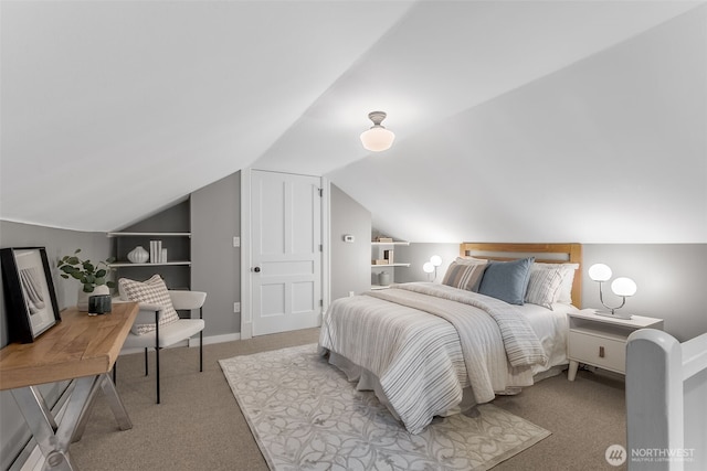 bedroom with lofted ceiling, baseboards, and light colored carpet