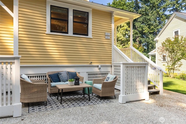 view of patio featuring stairs and an outdoor hangout area