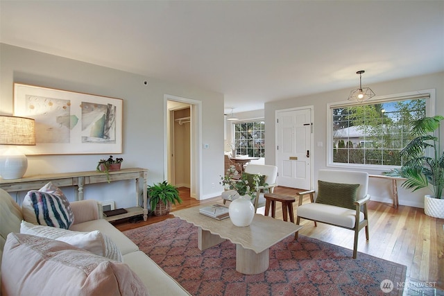 living room with light wood-style floors and baseboards