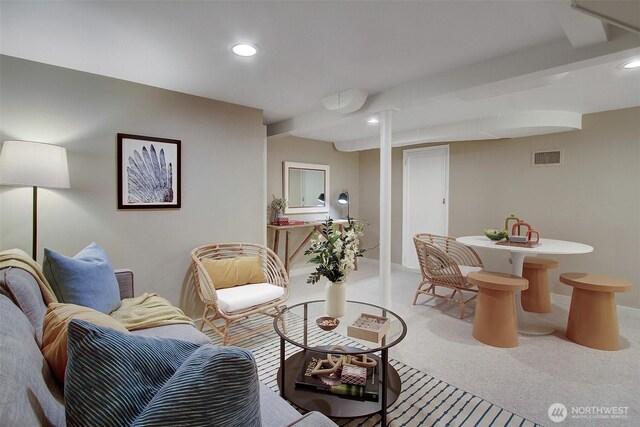 carpeted living area with baseboards, visible vents, and recessed lighting